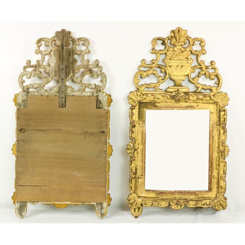 982 - A pair of late 18th Century Continental flat carved gilt Pier Mirrors, each crested with a carved va... 