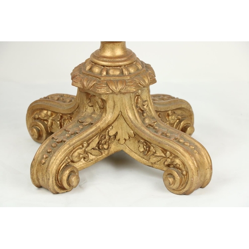 998 - A pair of composition gilt tripod Table Lamps, each moulded with leaves and grotesque masks, 25