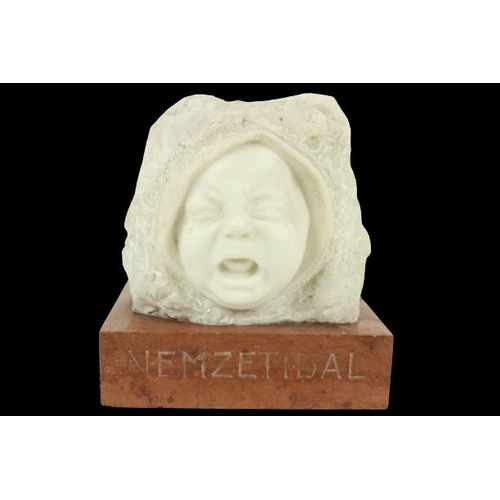 404 - A carved Carrara Head Study of a crying Infant, on rectangular rouge marble plinth; the plinth inscr... 