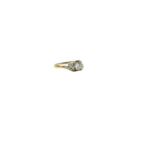 777 - A Ladies 18ct gold Ring Set, with large central diamond flanked to either side with two smaller diam... 