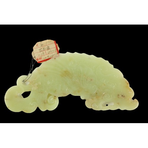 288 - A Chinese carved jade Pendant, modelled as stylized mythical sea creature, 6