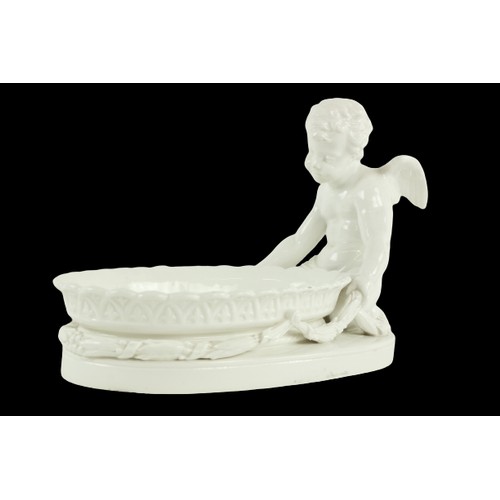 292 - An oval blanc-de-chine cherub Dish, of oval form, the cherub kneeling holding leaf swags around an o... 