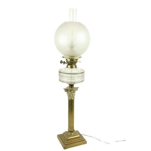 247 - A brass Oil Lamp, late 19th Century, with reeded stem and Corinthian capital on square stepped base ... 