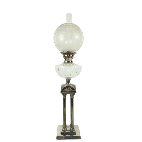 255 - A fine Architectural silver plated Oil Lamp, with cutglass reservoir supported by four Corinthian co... 