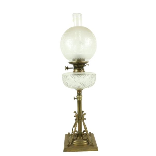 256 - A good telescopic brass and cutglass Oil Lamp, with cutglass reservoir and etched bulbous glass shad... 