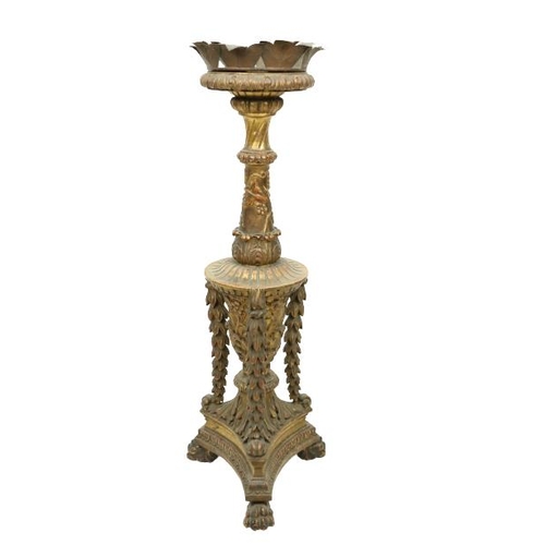 410 - A giltwood Georgian style Torchere, with floral decoration and drapes on a triform base with paw fee... 