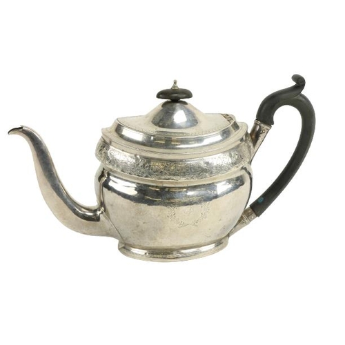 630 - A large boat shaped oval English silver Teapot, with bright cut decoration and armorial crests, Lond... 