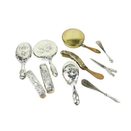 641 - Two Art Nouveau silver handed Mirrors, three similar Hand Brushes, two Shoe Horns, a Glove Stretch, ... 