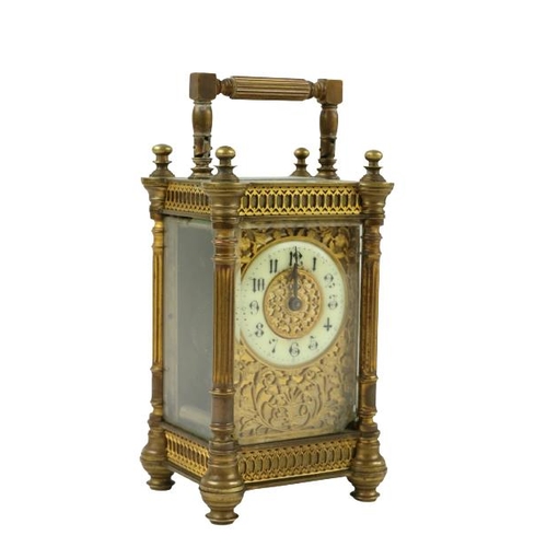 749 - A 19th Century ormolu cased Carriage Clock, with filigree design, enamel face, reeded pillars and hi... 