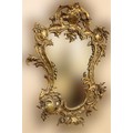 A Louis XVI style shield shaped brass Mirror, of rococo design with floral bouquet and plate mirror.... 