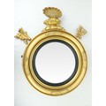 An Irish Georgian giltwood circular convex Overmantel Mirror, in the manner of Del Vecchio, with car... 