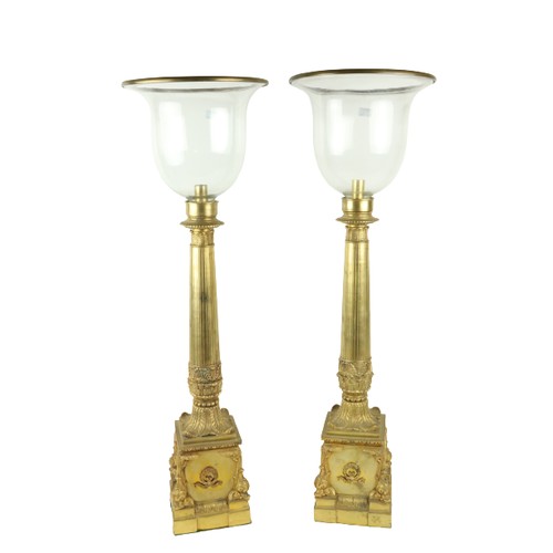 130 - An attractive pair of gilt and cast brass tall Candle Lanterns, each with a glass shade on a reeded ... 