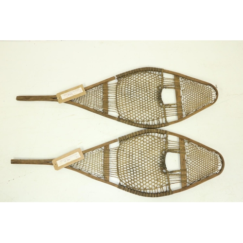 1592 - A pair of 19th Century racket shaped Snow Shoes, made of hardwood and seal sinew. (2)Provenance:  Hu... 