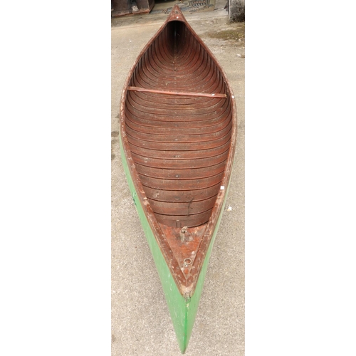 1594 - A late 19th Century American double ended peapod Canoe or Skiff, with latted interior and centre cro... 