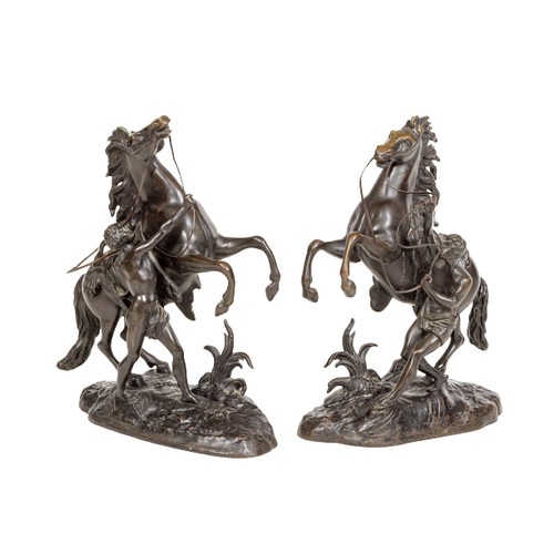 18 - After Guillaume Coustou A pair of bronze Marley Horse Groups, 16