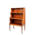 An unusual small George IV period mahogany Waterfall Bookcase, with three graduating shelves and bea... 