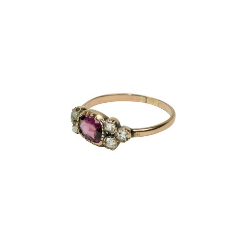 780 - An 18ct gold Ring, with centre oval garnet (Rhodolite), surrounded by six small princess cut round d... 