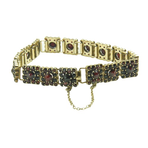 799 - A Ladies gold plated silver Bracelet, of link design with attractive ruby type pyramid shaped garnet... 