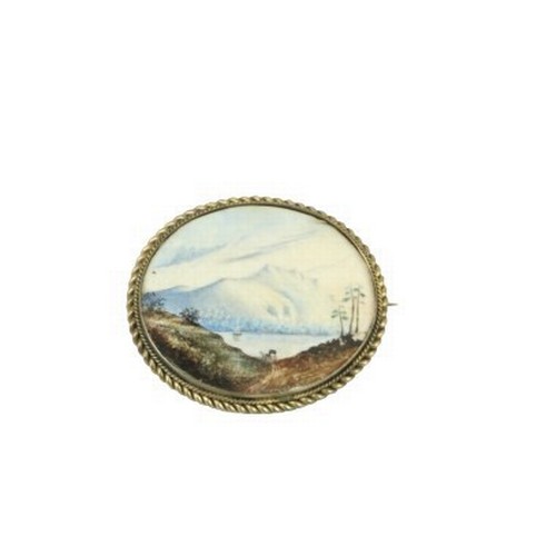 746 - A 19th Century oval Brooch, the inset painted with view of Mountainous Lake Scene, horse drawn carri... 