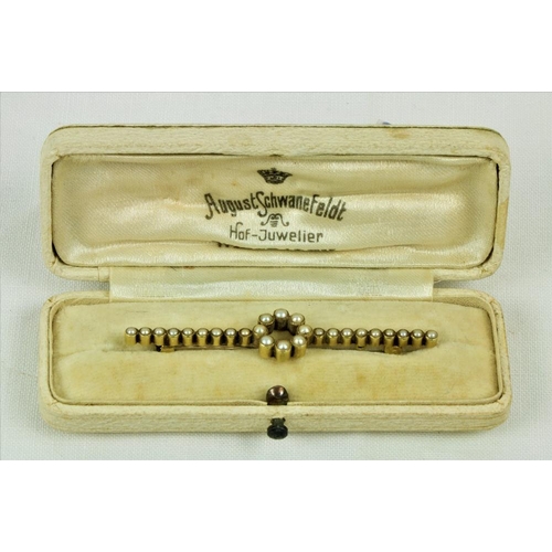 231 - A 15ct gold and seed pearl Bar Brooch, with circular centre. (1)