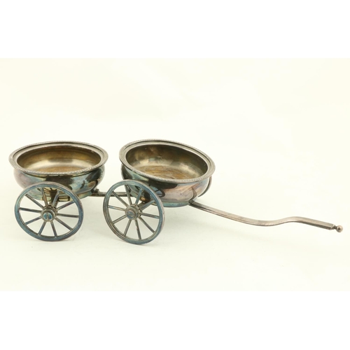 20 - A good silver plated two bottle Wine Wagon, with four spoked wheels and a shaft handle, 15