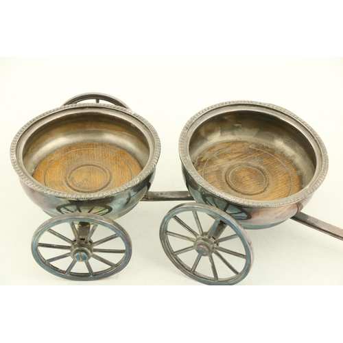 20 - A good silver plated two bottle Wine Wagon, with four spoked wheels and a shaft handle, 15