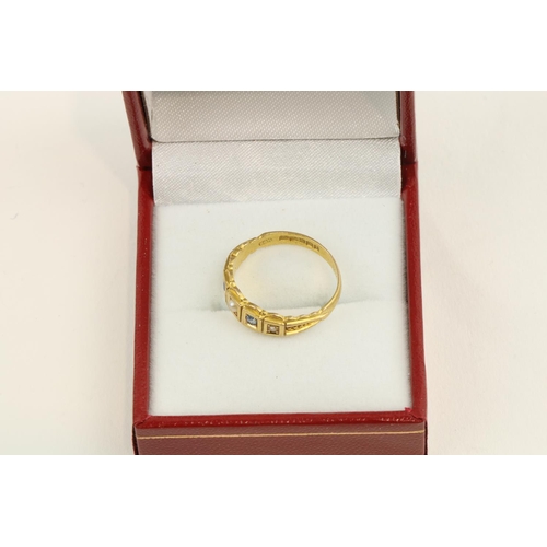 221 - An attractive 18ct gold Ladies Ring, with a straight band of eight diamonds recessed set, hallmarked... 