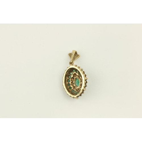 238 - An attractive Ladies gold set cluster diamond and emerald Necklace Drop, of oval form, approx. 3cms ... 