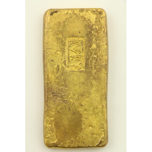 255 - A heavy Chinese gold coloured metal Ingot, with various marks, 330grs, 10cms (4'). (1)... 