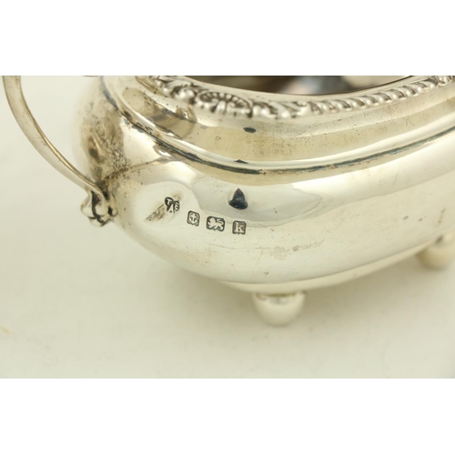 30 - A silver Sugar and Cream, Birmingham 1909, the ogee shaped Sugar Bowl with gadroon edge, shell corne... 