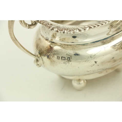 30 - A silver Sugar and Cream, Birmingham 1909, the ogee shaped Sugar Bowl with gadroon edge, shell corne... 
