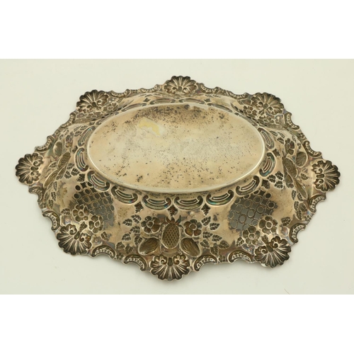 35 - An Edwardian embossed and pierced silver Bread Dish, Birmingham 1900, with shell and C scroll edge, ... 