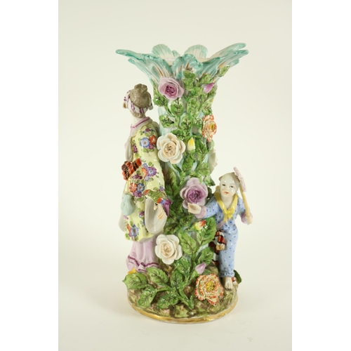 374 - A Sitzendorf porcelain Table Centre, with Asian mother and child around a flower encrusted tree, lac... 