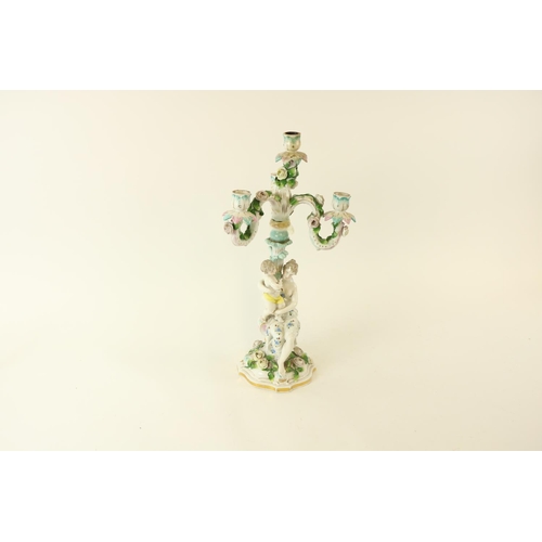 387 - A 19th Century Dresden porcelain flower encrusted Candelabrum, modelled with mother and child under ... 