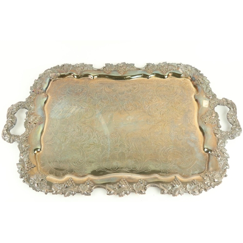4 - A heavy two handled Sheffield silver plated Tray, with vine cast shaped edge and handles, 71cms (28