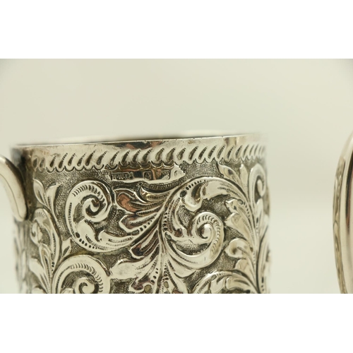 56 - A small silver Christening Mug, Birmingham 1910, with chased floral decoration on stem foot; togethe... 