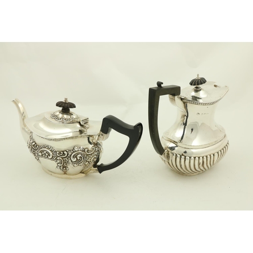 59 - A silver Teapot, with embossed floral and scroll decoration, Birmingham 1904, together with a Birmin... 