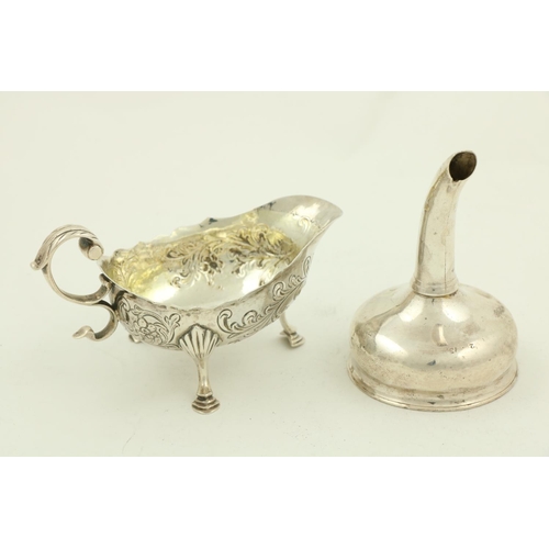 62 - A George III small silver helmet shaped Gravy Boat, London c. 1799, chased with floral and leaf scro... 