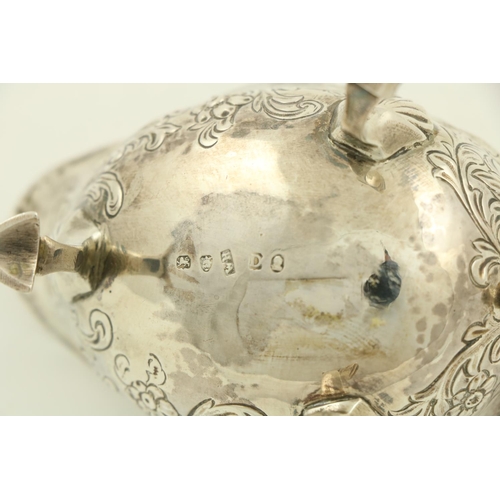 62 - A George III small silver helmet shaped Gravy Boat, London c. 1799, chased with floral and leaf scro... 