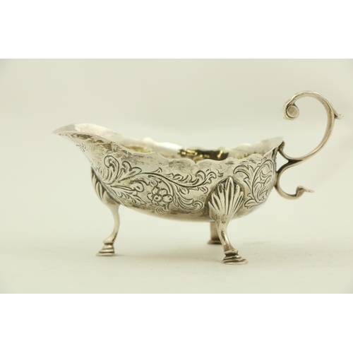 62 - A George III small silver helmet shaped Gravy Boat, London c. 1799, chased with floral and leaf scro... 