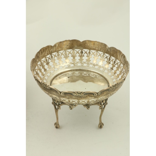 65 - A pierced silver Tazza, Chester 1911, with scroll cast edge on four cabriole legs with ball n' claw ... 