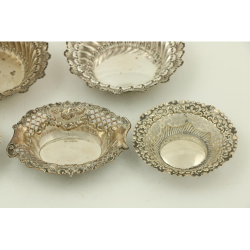 67 - A pair of circular modern Chester silver Bon Bon Dishes, each with leaf moulded edge and spiral flut... 