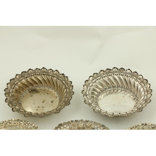 67 - A pair of circular modern Chester silver Bon Bon Dishes, each with leaf moulded edge and spiral flut... 