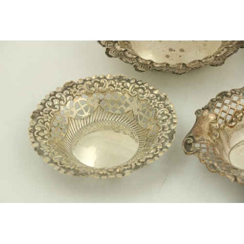 67 - A pair of circular modern Chester silver Bon Bon Dishes, each with leaf moulded edge and spiral flut... 