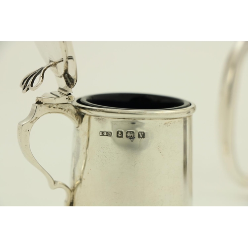 69 - A small silver Christening Mug, London 1927, together with a small Birmingham silver Mustard Pot wit... 