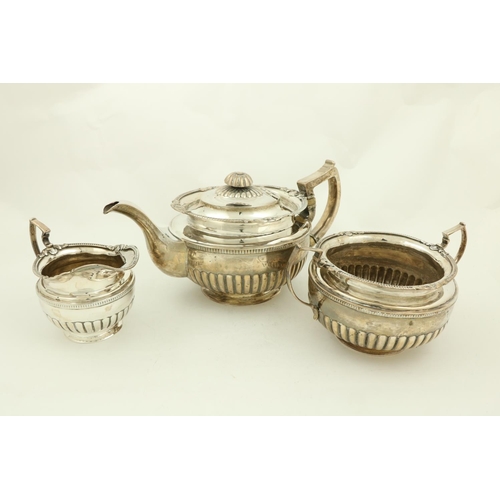 70 - A three piece late George III Irish silver Tea Service, by James Le Bass of Dublin 1819, the teapot ... 