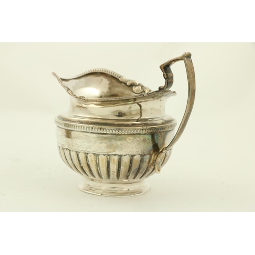 70 - A three piece late George III Irish silver Tea Service, by James Le Bass of Dublin 1819, the teapot ... 