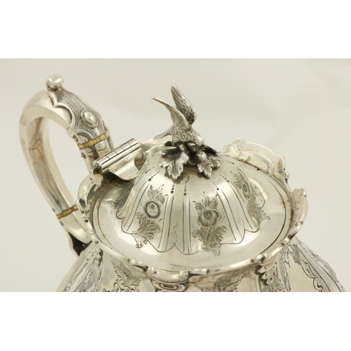 72 - A Victorian crested silver Teapot, London 1874, by Martin Hall & Co., the domed cover with a bir... 