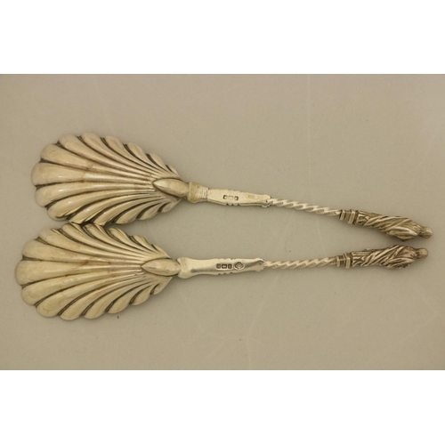 99 - A pair of George III feather edge London silver Sauce Ladles, with shell bowl; another similar ditto... 