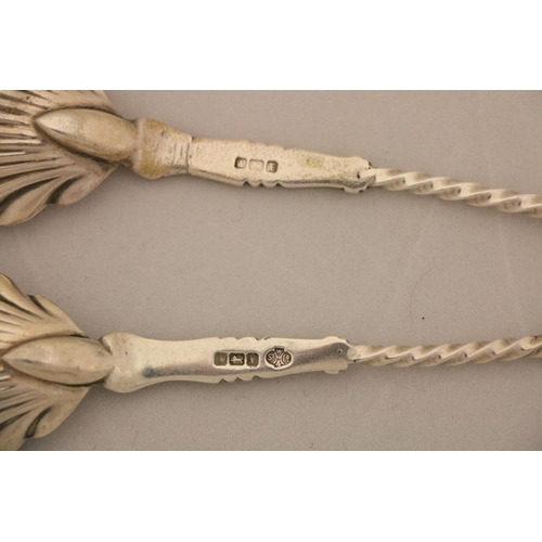 99 - A pair of George III feather edge London silver Sauce Ladles, with shell bowl; another similar ditto... 